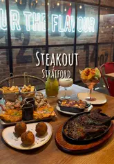 'Delicious prawn platter served at a vibrant halal restaurant in London, perfect for foodie enthusiasts.'