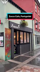 Delicious homemade banana bread with Greek yogurt and berries at Zucco, Pontypridd, perfect for a rainy day treat.
