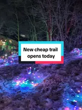 A vlog-style video showcasing a light trail and activity centre called Conkers. The creator walks through the venue, highlighting the light displays, the train ride, fairground-style games, soft play area, and the food options available, emphasizing the affordability of the experience for families.
