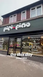 A short promotional video for Piri Fino, showcasing the restaurant's interior and a variety of dishes including peri-peri chicken, pasta, burgers, and sides. The video uses a montage style with music and text overlays to present the venue.