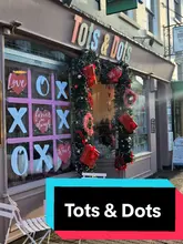 Moms and kids enjoying treats at Tots & Dots play cafe in Stony Stratford, featuring themed role play rooms.