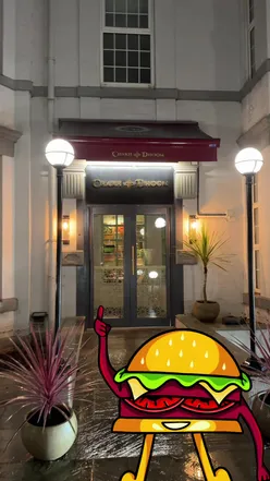 Group enjoying butter chicken and honey chicken at Chakhdhoom, a top Indian restaurant in Newcastle.