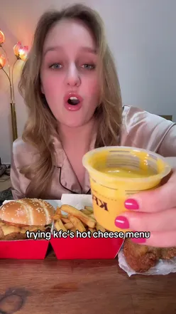 Reviewing KFC's hot cheese melt burger with onion relish in a tasty mukbang video.