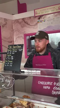 Bakery worker at LITTLE BLONDE BAKES expressing frustration about being filmed while working.