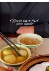 A short, punchy review of Canton Lane in Glasgow, featuring close-ups of various Chinese street food dishes like claypot beef brisket, crispy chili squid, and curry fish balls. The video includes shots of the restaurant's interior and exterior, providing a clear overview of the dining experience.