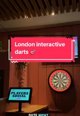 Players enjoying interactive darts and a Korean chicken burger at Players Social, Spitalfields, London. Ideal for fun date nights and group activities.