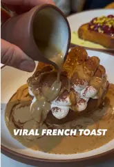 A short, engaging review of the viral French toast at Mallow, London Bridge. The video features close-up shots of the food being prepared and eaten, along with the creator's positive reaction, highlighting both the tiramisu and pistachio/cherry variations.