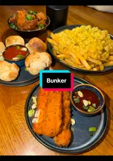 A lively display of unlimited sides and brand new cocktail kegs on a table at Bunker Bar Glasgow, ready for a night out.