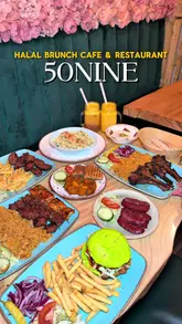 A montage video showcasing the interior and a variety of dishes at 50Nine, a Halal brunch cafe and restaurant. The video features slow pans of the dining area and close-ups of various Middle Eastern-inspired dishes, including lamb chops, mixed grills, and pasta.