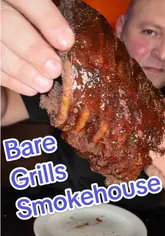 A review of Bare Grills Smokehouse in Bristol, featuring a variety of BBQ dishes including a BBQ tower, T-bone steak, and a monster hot dog. The video shows the kitchen preparation, the venue interior, and the creator tasting the food.