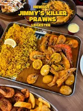 Stacked prawn platter and seafood boil brimming with juicy prawns, corn, and spices at Jimmy's Killer Prawns Leicester.
