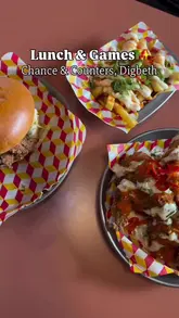 A short, punchy promotional video for Chance & Counters in Digbeth, showcasing the venue's board game library, casual dining space, and menu items including burgers, loaded fries, and corn.
