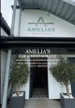 Diners enjoying burgers and drinks in the modern Amelia's Bar & Restaurant at Wolverhampton Halfpenny Green Airport.