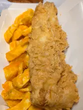 A food review of Tasty Plaice in Merry Hill, highlighting their fish and chips, jacket potato, doner kebab, and chicken bites.