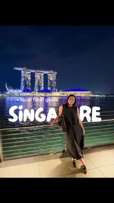 A fast-paced listicle video showcasing various popular food spots in Singapore, ranging from hawker centers to casual cafes and restaurants. The video uses a montage format with text overlays to identify each venue and highlight specific dishes.