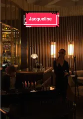 A short, cinematic montage showcasing the interior of a sophisticated bar in Mayfair, London. The video highlights the elegant decor, including a fireplace and live music, while featuring close-ups of cocktails to set the scene for pre-dinner drinks.