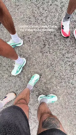 Team celebrating together at the BTR Half Marathon 2026 in Liverpool, focused on vibes and camaraderie.