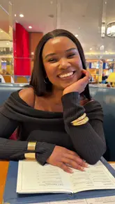 South African foodie enjoying authentic local cuisine at a vibrant Dublin restaurant, exploring city food and travel.