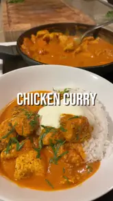 A clear and instructional home cooking video demonstrating the process of making a chicken curry from scratch, including marinating, searing, and sauce preparation.