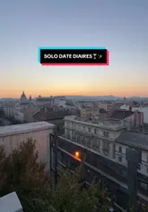 Solo female traveler watching a beautiful sunset, enjoying a peaceful solo date night with a stunning scenic view.
