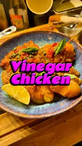 Tangy vinegar chicken thighs with crispy skin, capers, basil, and smashed potatoes, perfect for an easy gourmet dinner.