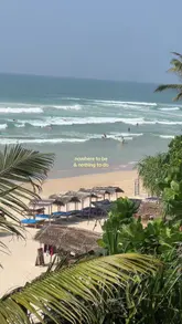 A beautiful beach hotel in Sri Lanka with palm trees, a sandy beach, and clear blue ocean.