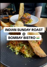 Indian style Sunday Roast platter with various curries, rice, and naan at Bombay Bistro, Edinburgh.