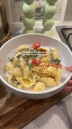 Delicious salmon feta pasta with cherry tomatoes and spinach, perfect for an easy one-dish dinner idea.