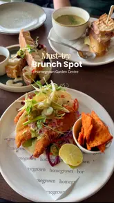 A review of a brunch spot located within a garden centre, featuring close-ups of various dishes, drinks, and the venue's interior. The video uses text overlays to highlight the menu items and the creator's positive experience.