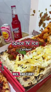 A review of a takeaway venue called Spice 'N' Ice, featuring a variety of dishes including a curry pizza, donner loaded fries, a munchie box, and dessert cookie pies. The video also highlights the shop's selection of imported snacks and drinks.