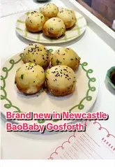A promotional reel for Baobaby in Newcastle, highlighting their handmade shengjian baos and specialty coffee/matcha. The video features close-ups of the cooking process, the final product, the menu, and the shop's interior and exterior.