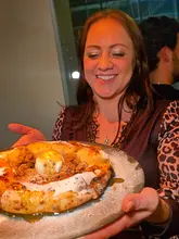 A fast-paced, engaging reel showcasing the opening of Forbici, a new pizza restaurant in Sheffield. The video features behind-the-scenes footage of pizza preparation, including the unique method of cutting pizza with scissors, as well as close-ups of various dishes like fritattina and a dessert pizza. The atmosphere is lively, and the food is presented in an appealing way.