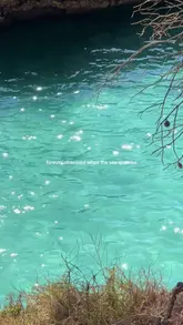 Glittery blue ocean water sparkling under the sun, capturing the beauty and wonder of the sea for travel.