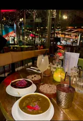 A short video showcasing a 'midnight brunch' experience at a Caribbean restaurant, featuring shots of food, cocktails, and the venue's evening atmosphere.