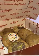 A chunky chocolate chip cookie topped with crunchy Cadbury Mini Eggs, from Cookie Jar London, popular with foodies in Slough.