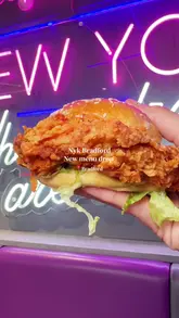 The image itself is not provided, so I'll generate a placeholder assuming it shows some of the food items mentioned, and then offer examples for specific image types.

**Placeholder Alt Text (assuming a general food display):**

An appealing display of new menu items from NYK Fried Chicken in Bradford, featuring burgers, loaded Sandoz, and cheesecake.

---

**More specific examples if you know what the image shows:**

*   **If it's mainly a burger:** "Close-up of a handcrafted burger with a thick patty from NYK Fried Chicken's new menu in Bradford." (109 chars)
*   **If it's mainly a Sandoz:** "A loaded Sandoz sandwich dripping with sauce, a new menu item from NYK Fried Chicken in Bradford." (106 chars)
*   **If it's mainly the cheesecake:** "A slice of Raspberry San Sebastian cheesecake, a new dessert from NYK Fried Chicken's menu in Bradford." (109 chars)
*   **If it's a spread of items:** "Spread of NYK Fried Chicken's new menu items in Bradford: handcrafted burger, loaded Sandoz, and Raspberry cheesecake." (120 chars)