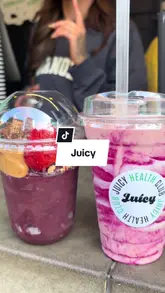 A creator visits a 'Juicy' health food venue, showcasing the menu, the exterior, the staff, and their order of a smoothie and an açai bowl. The video is a personal review, highlighting the fresh ingredients and the friendly service.