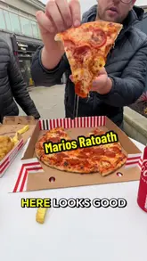 Chippy dinner from Mario's in Ratoath, Ireland. Assortment of classic takeaway food: battered fish, crispy chips, and a burger.