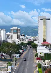 A lively street scene in Kingston, Jamaica, capturing the authentic daily life and culture of the island's vibrant capital city.