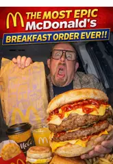 Close-up of a McDonald's UK McGriddle breakfast sandwich, featuring a sausage patty, folded egg, and cheese on syrupy griddle cakes.