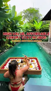 Purana Boutique Resort in Ubud, Bali, featuring a stunning swimming pool, lush tropical gardens, and luxurious amenities.