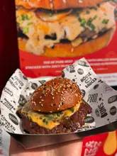 Winning chicken burgers from Dosa Kitchen & Dakwala at Battle of the Burger, Wylam Brewery, with a toffee apple cinny bun.