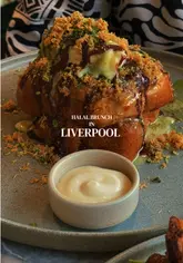 Delicious halal brunch food and coffee on tables inside Maison Cafe, Bold Street, Liverpool.