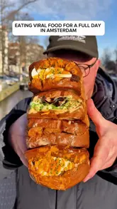 Person enjoying a full day eating a variety of popular viral food items and trendy dishes while exploring Amsterdam.