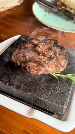 Delicious dishes served at The Grill Shack, showcasing a vibrant dining experience and mouthwatering food.