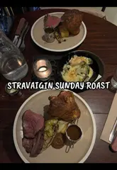 A personal vlog-style review of a Sunday roast experience at Stravaigin in Glasgow. The creator walks the viewer through the menu, the interior setting, and the specific dishes ordered, including soup, haggis, and a beef roast.