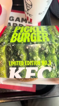 Delicious Pickle Burger from KFC, showcasing a juicy patty and tangy pickles, perfect for fast-food lovers.