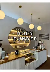 Stylish and welcoming Höfn coffee shop in Dundee city centre. Modern decor, warm lighting, and comfortable seating areas.