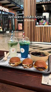 A short-form review video of 'House of Sliders' in Milton Keynes, featuring the creator tasting their sliders and BBQ tenders, while also showing the menu and venue exterior.