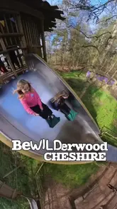 A family-focused vlog showcasing a day out at BeWILDerwood, highlighting the various outdoor play areas, slides, treehouses, and Easter-themed activities available for children.